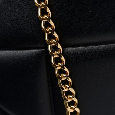 THE EMBOSSED Q CROSSBODY BAG